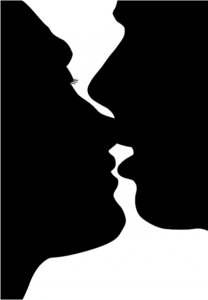 silhouette of two people kissing 